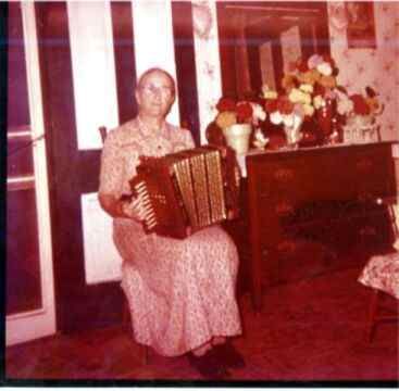 Mary Elizabeth Nixon Cook with accordian